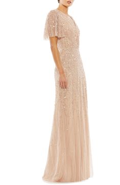 Enchantment is the aesthetic of this dreamy dress, done in a graceful, wrap-fronted silhouette and scattered with shimmering leaves. 100% polyester Spot clean Imported Beaded Leaves, Aubergine Color, Vestidos Color Coral, Column Skirt, Sleeve Gown, Unique Prom Dresses, Prom Designs, Designer Prom Dresses, Butterfly Sleeve