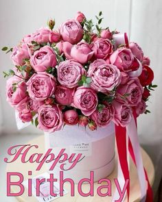 a birthday card with pink roses in a white box