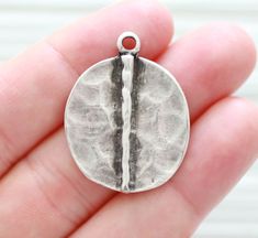 Rustic pendant silver, boho, hammered metal pendant, antique silver, organic shaped round earrings dangle, silver round charm H: 32 mm with top loop     W: 27 mm Many more round pendant and findings? Just click the link below:  https://www.etsy.com/shop/EastVillageSupply/items?ref=hdr_shop_menu&search_query=round%2Bpendant More pendants?  https://www.etsy.com/shop/EastVillageSupply?ref=seller-platform-mcnav&section_id=18450236 -Actual colors of any item or natural stones may slightly differ from screen to screen due to the screen resolution.  -I take all photos in daylight. But, due to the nature of gemstones, you might notice slightly differences in hues. -Please check out my store policies for discount codes! Silver Jewelry With Large Round Disc Pendant, Hammered Silver Circular Jewelry, Silver Hammered Oval Pendant Jewelry, Silver Hammered Circle Jewelry, Hammered Metal Round Disc Jewelry, Hammered Round Disc Metal Jewelry, Bohemian Hammered Round Pendant Jewelry, Sterling Silver Earrings With Coin Pendant, Silver Sterling Silver Earrings With Coin Pendant