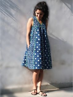 Kali Blue Block Printed Twirl Dress By Charkhee now available at Trendroots Indigo Print Dress, Sleeveless Cotton Dress With Batik Print, Blue Batik Print Sleeveless Dress, Blue Sleeveless Batik Print Dress, Blue Sleeveless Dress With Batik Print, Blue Bohemian Bandhani Print Dress, Blue Bohemian Dress With Bandhani Print, Traditional Blue Cotton Dress, Traditional Bandhani Print Summer Dress