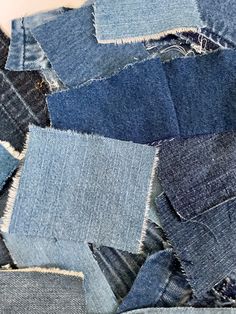 a pile of blue jeans that have been cut in half