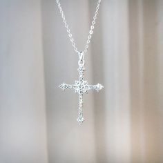 Victorian Silver Cubic Zirconia Sparkly Religious Faith Cross Necklace Silver Cubic Zirconia Sparkly Religious Cross Charm Pendant Necklace Silver Plated Cubic Zirconia Cross Charm Pendant Necklace. It Beautiful Features Round-Cut Stones Made With Aaa Zirconia In A Cross Shape. Embedded Shiny Rhinestones / Luxurious Cross That Sparkles And Shines Adjustable Length 18" Inches With A 2" Extender Cross Pendant Height 1 3/4" Width 1" #Crossnecklace #Aprilbirthstone #Religiousnecklace #Diamondnecklace #Victorian Wwjd Faith Diamond Cross Necklace, Dainty Pave Cross Necklace, Baptismgift,Cross Jewelry, Communion Cross Necklaces, Religious Protective Necklace Crystal Diamonds Elegant Silver Cross Necklace With Cubic Zirconia, Sterling Silver Rhinestone Necklace For Gift, Elegant Cubic Zirconia Cross Necklace With Clavicle Chain, Elegant Rhinestone Cross Necklace On Clavicle Chain, Elegant Rhinestone Cross Clavicle Necklace, Elegant Cross-shaped Rhinestone Necklace For Parties, Elegant Cross Rhinestone Necklace For Parties, Silver Crystal Cross Pendant Necklace, Cubic Zirconia Crystal Necklace With Rhinestones As Gift