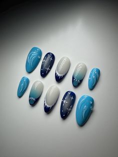 3D Blue and White Press On Nails made for you. In the picture - almond nail shape.   Very high quality and will last you up to 2 weeks. After right removal can be reusable. Just choose the shape and length of the nail you would like and choose the size of your nail bed, or choose the option - custom.  I highly recommend to purchase my Nail Sizing Kit from my page to make sure they fit perfectly before purchasing any designed Press On Nails Icy Blue And White Nails, Blue Christmas Nail Art, Blue Christmas Nails Almond, Blue And White French Nails, Almond Nails Designs Blue, New Years Nails Blue, Blue Snow Nails, Almond Nails Designs Winter, Blue Xmas Nails