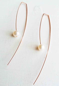 Long delicate arc shape threader earring made of 14k rose gold filled wire and floating 6mm white fresh water pearl. Earrings pictured measures 3 inches long from point of entry in ear. Pearl dangles 1 3/4 inches from point of entry of ear. Back sweep measures 1 1/4 inch from bottom of pearl. Also Available in 14K yellow gold filled, 14K rose gold filled, and sterling silver. Shorter lengths are also available. bluewavejewelry.etsy.com Crisscross hoops: https://www.etsy.com/listing/234139174/cri Minimalist Rose Gold Teardrop Earrings, Minimalist Long Drop Pearl Earrings With Ear Wire, Elegant Rose Gold 14k Gold-filled Threader Earrings, Elegant 14k Gold-filled Rose Gold Threader Earrings, Minimalist Wire Wrapped Pearl Drop Earrings, Elegant Rose Gold Threader Earrings With Ear Wire, Rose Gold Teardrop Pearl Earrings With Ear Wire, Elegant Rose Gold Threader Earrings, Delicate Rose Gold Dangle Linear Earrings