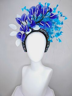 The Hat Doctor From the 2024 Featured Milliner of the Kentucky Derby Museum  kentucky derby hat fascinator iridescent blue rhinestone crystal headband with blue wire flowers,ocean blue feathers,white velvet leaves each hat is totally one of a kind! no two are alike! I can probably add feathers, flowers etc to existing hats for a small fee. I cannot remove anything from existing hats. Just message me and see if we can make it work! :) I cannot make custom order from scratch. My schedule is unfort Blue Headpieces For Carnival, Blue Costume Hats And Headpieces For Carnival, Adjustable Blue Feathered Headpiece, Adjustable Blue Feather Headpiece, Blue Feather Headpiece For Kentucky Derby, Blue Feathered Headpiece For Kentucky Derby, Velvet Leaves, Derby Hats Fascinators, Blue Feathers