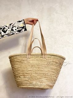 "This bag is handwoven in the souks of Morocco, from a palm leaf. It is a \"Slow Fashion\" product representing everything that is eco, ethical and green. Even though this Spring & Summer season is all about straw. Small round wicker French basket, hand woven in Marrakesh by friends and family. Ideal small shopper or beach bag. Also a perfect bag or gift for a girl - great for school books etc. This braided bag is perfect anytime and everywhere, Especially in the summer and there are those who l Summer Everyday Classic Bag, Traditional Everyday Summer Bags, Traditional Summer Bags With Leather Handles, Traditional Natural Straw Bag For Travel, Natural Palm Leaf Beach Bag For Travel, Palm Leaf Tote Beach Bag With Leather Handles, Palm Leaf Beach Bag With Leather Handles, Rectangular Palm Leaf Beach Bag With Leather Handles, Artisan Natural Beach Bag For Travel