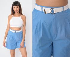 "Vintage 80s shorts in blue with a high waist and front pleats. Cuffed leg and a white belt.  Please see measurements and condition below. Every garment we sell is authentic vintage and one-of-a-kind! You will receive the exact item photographed. Condition: Very good vintage. Best fits women's: Small to medium. Tag: stacey michaels Material:  Cotton / polyester blend MEASUREMENTS Taken from seam to seam while the garment is lying flat. Double the armpit, waist, and hips For reference, model is 5 Blue Belted Bottoms For Summer, Blue Bottoms With Belt For Summer, Blue Summer Bottoms With Belt, Summer Cotton Bottoms With Belt, High Waist Belted Shorts For Spring, Spring High-waisted Shorts With Belt, White Belted Bottoms For Summer, White Belted Shorts For Summer, Blue Belted Summer Bottoms