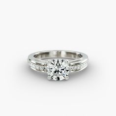 a white gold engagement ring with diamonds on it