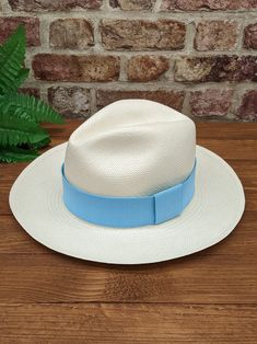 Handmade Panama Hat and Removeable ~ Light Blue ~ Accessory Band The band is interchangeable and can be removed to reveal a plain dark band underneath (dark band fixed to hat). The removeable band is elasticated and will stretch for different size hats. Create different looks for your hat by adding different colour bands. You can find more in our shop: https://www.etsy.com/shop/personalisedpanamas/?etsrc=sdt§ion_id=44636577 ~ Genuine Panama hat handwoven with Toquilla palm ~ ~ Handwoven in Ecuad Classic Blue Hats With Curved Brim, Classic Blue Hat With Curved Brim, Classic Fitted Blue Hat, Adjustable Brimmed Blue Top Hat, Adjustable Blue Boater Hat With Flat Brim, Blue Adjustable Fedora For Kentucky Derby, Blue Adjustable Top Hat With Short Brim, Adjustable Blue Top Hat With Short Brim, Blue Top Hat With Adjustable Short Brim