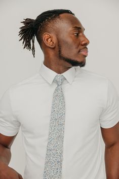 We pride ourselves in offering our customers some of the best skinny ties money can buy. Each DAZI tie is handmade from high quality imported fabrics. Features: Approx. 2.5" wide at the tip Approx. 58" in length 100% Cotton Dapper Fitted Tie, Dapper Standard Tie, Dapper Fitted Standard Tie, Fitted Cotton Suit And Tie Accessories, Fitted Cotton Tie, Dapper Fitted Neckwear For Semi-formal Occasions, Fitted Standard Tie For Business, White Business Ties, Semi-formal Spring Ties