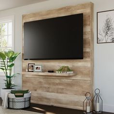 a living room with a large flat screen tv mounted to the side of a wall