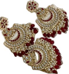 Red Temple Jewelry For Eid, Red Jewelry For Eid Celebration, Elegant Red Chandbalis With Cutdana, Elegant Red Jhumkas For Festive Occasions, Red Cutdana Earrings For Puja, Traditional Red Tikka As Gift, Festive Ruby Meenakari Danglers, Heavy Red Ruby Chandbalis, Red Temple Jewelry Danglers For Wedding