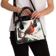 Looking for a practical yet stylish shoulder bag that can take you from day to night? Look no further than our Christmas Cardinal in the Snow premium handbag. Featuring a gorgeous and vibrant fine art print, this bag is a true statement piece that will elevate any outfit. And with its convenient zippered top closure, you can trust that your belongings will stay safe and secure. But that's not all! This versatile bag also comes with a removable and adjustable shoulder strap, allowing you to wear Double Handle Bags With Adjustable Handle For Gifts, Gift Bags With Adjustable Double Handle, Gift Shoulder Bag With Adjustable Double Handle, Gift Shoulder Bag With Double Adjustable Handle, Casual Top Handle Satchel Gift, Gift Satchel With Adjustable Handle And Tote Shape, Casual Satchel For Gift, Casual Satchel For Gifts, Gift Satchel With Adjustable Strap And Double Handle