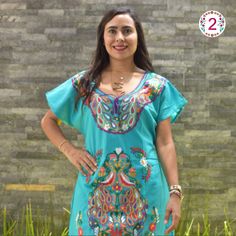 This lovely dress was handmade in Mexico. The beautiful colorful flowers were embroidered by hand, so each one is unique. You will love wearing this comfortable cotton dress with short sleeves. It is perfect for a hot summer day. This dress comes just above or below the knee, depending on how tall you are. It has a square neckline and cute little puffy sleeves.  Inch measure Medium 19 * 35 Large 23 * 37 XL 26 * 37 XXL 27 * 38 About Our Items: Each one of our items is handmade/hand woven by Indigenous communities of Chiapas and Oaxaca in Mexico. Great care has been taken to ensure the quality and uniqueness of each item we sell.  Our items are made of cotton. Each flower on each item will be a bit different as they were embroidered carefully by hand. Care Instructions: Please take care to h Festival Embroidered Dress With Traditional Patterns, Green Cotton Dress With Intricate Embroidery, Bohemian Green Dress With Intricate Embroidery, Green Bohemian Dress With Intricate Embroidery, Multicolor Embroidered Dress With Traditional Patterns, Bohemian Green Dress With Embroidered Neckline, Green Dress For Beach Festivals, Traditional Dresses With Traditional Patterns For Summer, Traditional Summer Dresses With Traditional Patterns