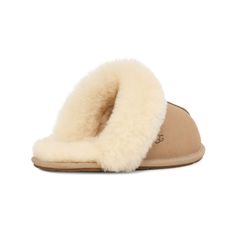 The women’s super cozy ‘Scuffette’ slippers from UGG are a classic style and wardrobe staple. These quintessential house slippers are crafted from premium water-resistant suede and plush sheepskin wool lining with a rubber and cork sole. An easy to wear slip on style featuring closed toe. Signature UGG branding is seen throughout. This stylish pair of slippers are perfect for those cozy Winter nights in. Winter Nights, Cozy Winter, House Slippers, Womens Uggs, Top Shoes, Wardrobe Staples, Cork, Classic Style, Slippers