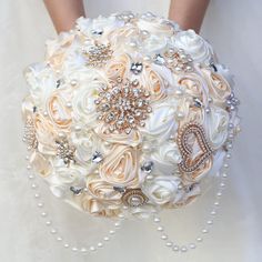 a bridal bouquet with pearls and brooches