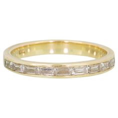 A three/fourths eternity ring channel set with the most beautiful diamond baguettes making this a very special ring. -14k solid gold -9, 3x1.75mm diamond baguettes -.6 total carat weight Luxury Timeless Eternity Band With Channel Set, Baguette Cut Eternity Band With Diamond Accents, Gold Eternity Band With Baguette Diamonds, Formal Baguette Cut Eternity Band With Channel Set, Formal Baguette Cut Channel Set Eternity Band, Classic Yellow Gold Eternity Band With Baguette Diamonds, Yellow Gold Eternity Band With Baguette Diamonds, Channel Set Baguette Cut Diamond Eternity Band, Baguette Diamond Band