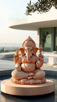 a statue of an elephant sitting on top of a table next to a building and pool