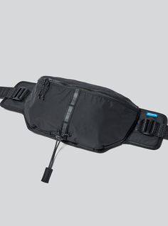 a black fanny bag on a gray background