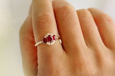 "Ruby Ring / 14k Three Stone Natural Ruby Cluster Ring / Classic Genuine Ruby Engagement Ring 14k Gold / July Birthstone / Promise Ring Features *Made to Order *Gold Kt: 14K (also available in 18K) *Available Gold Color: Rose Gold, Yellow Gold, White Gold *Oval Shape Ruby: 1 pc 6 x 4MM *Oval Shape Ruby: 2 pc 4x3MM *Round Diamonds: 10 pcs 1.55 MM *Ruby CTW: 1.23 ctw *Diamond CTW: 0.16 ctw *Ready to Ship in 7-10 Business Days If you have any additional questions about this product, just hit the \" 14k Gold Birthstone Cluster Ring, Fine Jewelry Ruby Ring With Three Stones, Fine Jewelry 14k Gold Cluster Promise Ring, 14k Gold Cluster Ring For Promise Occasions, Fine Jewelry 14k Gold Cluster Ring For Promise, 14k White Gold Cluster Promise Ring, 14k Gold Cluster Ring Gift, Fine Jewelry Promise Ring With Cluster Shape, Promise Ring With Cluster Shape Fine Jewelry