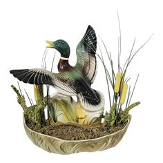 a bird sitting on top of a planter filled with grass and plants in it