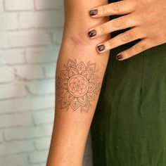 a woman's arm with a tattoo on it