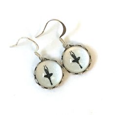 pair of dangle earrings with ballerina silhouette