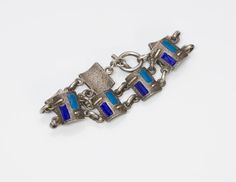 Vintage Enamel & Silver Bracelet Blue enamel and silver (800) link bracelet with bar & ring toggle clasp. Approximate Measurements: Length 7.5", Width 0.7" Weight: 33 Grams Enamel Bracelet Jewelry With Lobster Clasp, Enamel Bracelet With Lobster Clasp, Blue Enamel Bracelet Jewelry, Bar Ring, Bracelet Blue, Silver Enamel, Blue Bracelet, Toggle Clasp, Buy Vintage