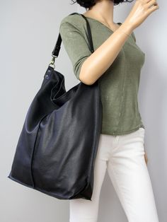 Black leather hobo bag with zipper- everyday soft bag. **Dimensions Height: 18,5 inch (47 cm) Width: 18,1 inch (46 cm) Length of handle: 19,3 inch (49 cm) Bottom width: 13,4x 5,9 inch (34x15 cm) Internal pocket: 8,7x 6,7inch (22 x 17 cm) Large, very roomy bag made of thick yet soft cattle leather. The bag can be worn as a shoulder bag. Detachable shoulder strap. There is a lot of space and you can put there everything in your everyday life. It has a top zip closure. Add this gorgeous bag to your Everyday Hobo Bag With Zipper Closure, Versatile Black Hobo Bag For Daily Use, Hobo Bag With Zipper Pocket For Daily Use, Everyday Large Capacity Black Hobo Bag, Daily Use Hobo Bag With Zipper Pocket, Black Canvas Hobo Bag For Daily Use, Black Hobo Bag With Zipper Pocket, Versatile Black Hobo Bucket Bag, Everyday Hobo Shoulder Bag With Zipper