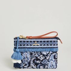 Embroidered Band Along Top Of The Wristlet Lined With Fringe Underneath Hanging Three-Tiered Tassel Fob Interior Features: Zipper Pocket Napa Leather Wristlet Strap Dimensions: 8.875'' W; 6.5'' H; 1.75'' D Blue Woven Clutch, Paisley Color, Sea Bags, Pink Clutch, Spartina 449, Zippered Clutch, Navy Linen, Blue Island, Summer Patterns