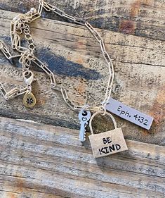 Personalized Mixed Metal Hand-stamped necklace with 3 stamped charms. "And be kind and compassionate to one another, forgiving one another, just as God also forgave you in Christ." Ephesians 4:32 HCSB This necklace design includes 3 hand-stamped charms:  Gold plated padlock charm hand-stamped with the words "Be Kind", stainless steel silver charm stamped with scripture reference "Eph 4:32", and a tiny silver key charm hand-stamped with a heart.   Choose this necklace or design your own by submitting your word(s)and scripture reference in the "Note to Seller" section when placing your order. Each piece is hand designed with slight imperfections and no two are exactly alike...just as God designed us one by one.  We can praise God as we see these imperfections as a reminder that through the b Adjustable Inspirational Nickel-free Charm Necklace, Inspirational Adjustable Nickel-free Charm Necklaces, Everyday Spiritual Nickel-free Charm Necklaces, Everyday Meaningful Nickel-free Charm Necklaces, Nickel-free Spiritual Charm Necklaces For Everyday, Word Necklace, Ephesians 4, Silver Key, Hand Stamped Necklace