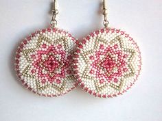 two pink and white beaded circular earrings