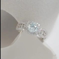 an engagement ring with three diamonds on it