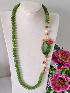 Necklace made with 14 mm hand-knotted green peridot hard stones, prickly pear in Caltagirone ceramic made and painted by hand, with 22 kt gold leaf applications, 6 cm size, white pearls and Mediterranean red coral, length 70 cm. Green Pearl Necklace, Accessory Ideas, Ceramic Necklace, Green Pearls, Bib Necklaces, Prickly Pear, Green Peridot, Morning Messages, Red Coral