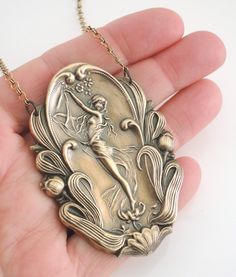 "Art Nouveau Necklace - Statement Necklace - Vintage Necklace - Vintage Brass Necklace - Goddess Necklace - handmade jewelry This is such a beautiful vintage necklace! A large brass Art Nouveau pendant hangs from a pretty vintage brass ladder chain. Incredible detail. So very bold and feminine. Chloe says, \"Wear it and feel fabulous!\" This pendant is 3 3/4\" tall and 2\" wide. You can choose the necklace length you would like at checkout. Thanks for visiting Chloe's" Vintage Antique Gold Necklace Gift, Vintage Necklace With Antique Finish As Gift, Vintage Antique Finish Necklace As Gift, Vintage Antique Finish Necklace For Gift, Decorative Antique Gold Necklaces For Gifts, Vintage Handmade Pendant Jewelry, Decorative Antique Gold Necklace For Gift, Handmade Vintage Pendant Jewelry, Vintage Bronze Jewelry For Crafting