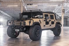 a hummer truck is parked in a parking garage