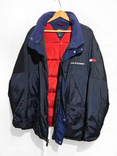 Vintage 90s Tommy Hilfiger Goose Down Proof Hooded Parka jacket Block Logo Spell Out Multi Pocket Navy Blue Size XL Condition: Normal Trace of Use Overall Good Size: X-Large lenght : 31,5 Pit to Pit: 27.5 Arms: 26 Any questions just ask! Please keep in mind that colours from the pictures may vary because of your screen. I SEND WITH TRACKING NUMBER! If any item is lost or damaged in transit I will make a claim with the Post Office but refunds will not be given until the claim has been processed. Navy Hooded Puffer Jacket With Pockets, Navy Hooded Casual Puffer Jacket, Blue Outerwear With Multiple Pockets, Casual Navy Hooded Puffer Jacket, Blue Windbreaker With Pockets For Cold Weather, Blue Streetwear Outerwear With Multiple Pockets, Blue Winter Windbreaker With Pockets, Navy Outdoor Puffer Jacket With Pockets, 90s Style Winter Windbreaker With Pockets