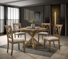 a wooden table with four chairs around it