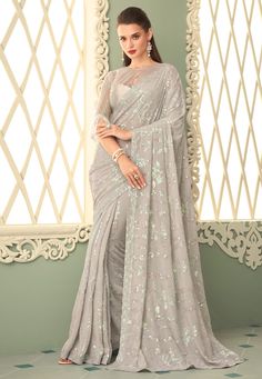 Grey georgette saree with blouse 7203  Desc:  Style : Sequence Sarees Color : Grey Fabric : Georgette Work : Sequence Wash Care : Dry clean Sleeve Style : Quarter Sleeve Long Sleeves : Done only in Custom Stitch Sleeves Lining : Done only in Custom Stitch Bust Size : 32 to 42 Inches Occasion : Party Wear   Wedding   Festival   Christmas   Kitty Party   Sangeet   Engagement   Reception   Ceremonial. With Express Free Shipping and Custom Stitching, Buy Indian Party wedding and bridal sarees Grey g Grey Saree Party Wear, Bollywood Sarees Online, Reception Saree, Formal Saree, Saree Party Wear, Sequence Saree, Sequin Saree, Grey Saree, Party Sarees