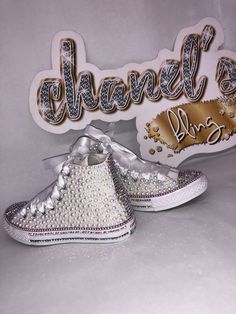 Custom Bling Converse All Star Chuck Taylor Sneakers. All designs handmade and embellished with a variety of high quality crystals. Great for weddings, proms, homecomings, birthdays, special events or just your everyday girly girl. **IF YOU NEED THIS ITEM BEFORE THE PROJECTED SHIPPING TIME YOU MUST CONTACT US BEFORE ORDERING (additional charges may apply) ** Shoe Details:Classic White high top Converse All Star Chuck Taylor Sneaker (Cloth Material) Shoe Size: Sizes stating at INFANTS 2C TO BIG K White High Top Converse, Ribbon Shoes, Bling Converse, High Top Converse, Custom Bling, White High Tops, Converse High Tops, Converse All Star, Chuck Taylor Sneakers