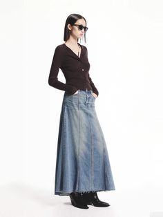 MO&Co. Women's A-line Maxi Denim Skirt This denim skirt is expertly crafted from comfortable cotton, offering a lightly faded blue wash and raw hem for a trendy touch. Its A-line maxi silhouette adds a flattering and versatile option to any wardrobe. Pair with our knit cardigan for a stylish look. Features : - High waist A-line maxi silhouette- Seams detail and raw hem- Zip fly, Side pockets Code: MBD3SKT027The back length of size S is 91.5cmMATERIALS & CARE Material: 100% CottonPlease put it in Maxi Denim Skirt, Denim Skirt Outfits, Trendy Denim, Denim Maxi Skirt, Denim Trends, Raw Denim, Knitted Cardigan, Skirt Outfits, Long Skirt