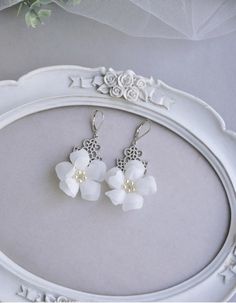 Delicate cute flowers earrings for a fabulous image of the bride Elegant Flower Earrings For Summer, Elegant Summer Jewelry With Flower Decoration, Elegant Summer Earrings With Flower Decoration, Elegant Flower Charm Earrings For Summer, Elegant Handmade Summer Flower Earrings, Delicate Summer Wedding Earrings, Handmade Flower Chandelier Earrings For Wedding, Elegant Handmade Flower Earrings, White Flower Decorated Earrings For Parties