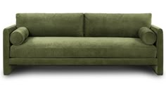 a green couch sitting on top of a white floor