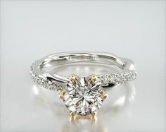 a white gold engagement ring with diamonds on it