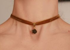 Bronze rose beige velvet ribbon choker Choker -necklace with beige velvet ribbon and charm- bronze rose. Flower's dia 15-17 mm Length of choker is adjustable: 28-33 cm/11-13 inch or 33-38 cm/13-15 inch or 14-16 inch/ 35.5 cm-40.6 cm Width of ribbon 10 mm / 0.4 inch If you need other length of necklace let me know and I will make it for you. ♥All my jewelry come in boxes or bags . If you are purchasing a gift I am happy to include personalised messages with your order. Please leave a note of desi Polymer Clay Choker, Adjustable Rose Gold Choker, Rose Gold Choker For Gift, Brown Vintage Charm Jewelry As Gift, Vintage Round Choker As A Gift, Vintage Round Choker As Gift, Clay Charm Necklace, Ribbon Choker Necklace, Velvet Necklace