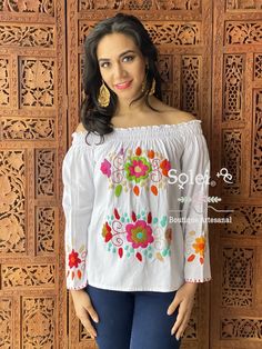 This Beautiful Hand Embroidered Mexican blouse is comfortable and stylish. It has elastic around the shoulders and 3/4 length sleeves with embroidered flowers at the end. Please Note: Since this is hand embroidered the embroidery may vary from piece to piece. White Embroidered Off-shoulder Top, Cotton Off-shoulder Tops With Floral Embroidery, Off-shoulder Cotton Top With Floral Embroidery, Embroidered Off-shoulder Cotton Tops, Cotton Embroidered Off-shoulder Tops, Fitted Off-shoulder Embroidered Top, Mexican Blouse, Embroidered Belt, Beautiful Belts