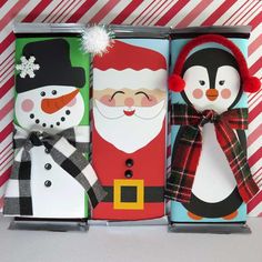 three boxes with christmas decorations in them