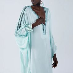 Reach For This To Channel Old School Glam While Keeping It Light And Easy For Your Resort Edit. This Classic, Silky Organic Caftan Shape Features Luxe Hand Beaded Detail Along The Sleeve And At V-Neck. Loose-Fitting With Slits On The Side, It Radiates A Luxurious, Elegant Summertime Vibe. Stun In The Sun From St Barths To Biarritz In This Delight. 60% Vis(Flos) 40% Vis One Size Long Sleeve Embellished Kaftan For Beach, Embellished Long Sleeve Kaftan For The Beach, Beach Long Sleeve Embellished Kaftan, White Sundress Long, Animal Print Maxi Dresses, St Barths, Halter Neck Maxi Dress, Beaded Crochet, Grey Maxi Dress