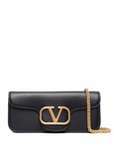 Black leather VLogo clutch bag from VALENTINO GARAVANI featuring VLogo Signature, detachable chain-link shoulder strap, foldover top with magnetic fastening and internal patch pocket. | Valentino Garavani VLogo clutch bag Mario Valentino, Black Clutch, Leather Cap, Beach Tote Bags, Luxury Brands, Handbag Backpack, Mens Shoes Sneakers, Shoulder Handbags, Valentino Garavani