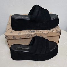 Free People Almost Paradise Platform Blk/Noir 3 Size 38 Eu 8 66684663 Take Every Step In Style And Confidence Wearing Free People Almost Paradise Platform Heels. Textile Upper. Leather Lining And Insole. Slip-On Closure. Brand Logo On Insole. Platform Heel. Open Round Toe. Synthetic Outsole. Imported. Product Measurements Were Taken Using Size Eu 38 (Us Women's 8), Width M. Please Note That Measurements May Vary By Size. Measurements: Heel Height: 2 12 In Platform Height: 1 34 In Black Suede Sandals With Textured Footbed, Black Wedge Heel Sandals With Textured Sole, Black Suede Platform Sandals, Black Suede Sandals With Removable Insole, Black Suede Sandals With Cushioned Footbed, Black Suede Wedge Heel Sandals, Comfortable Black Suede Sandals, Comfortable Black Low-top Sandals, Black Leather Low-top Sandals